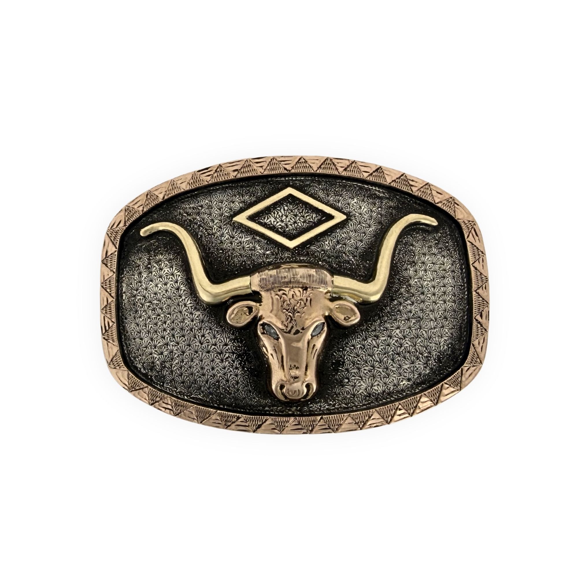 Belt buckle with longhorn design on a white background