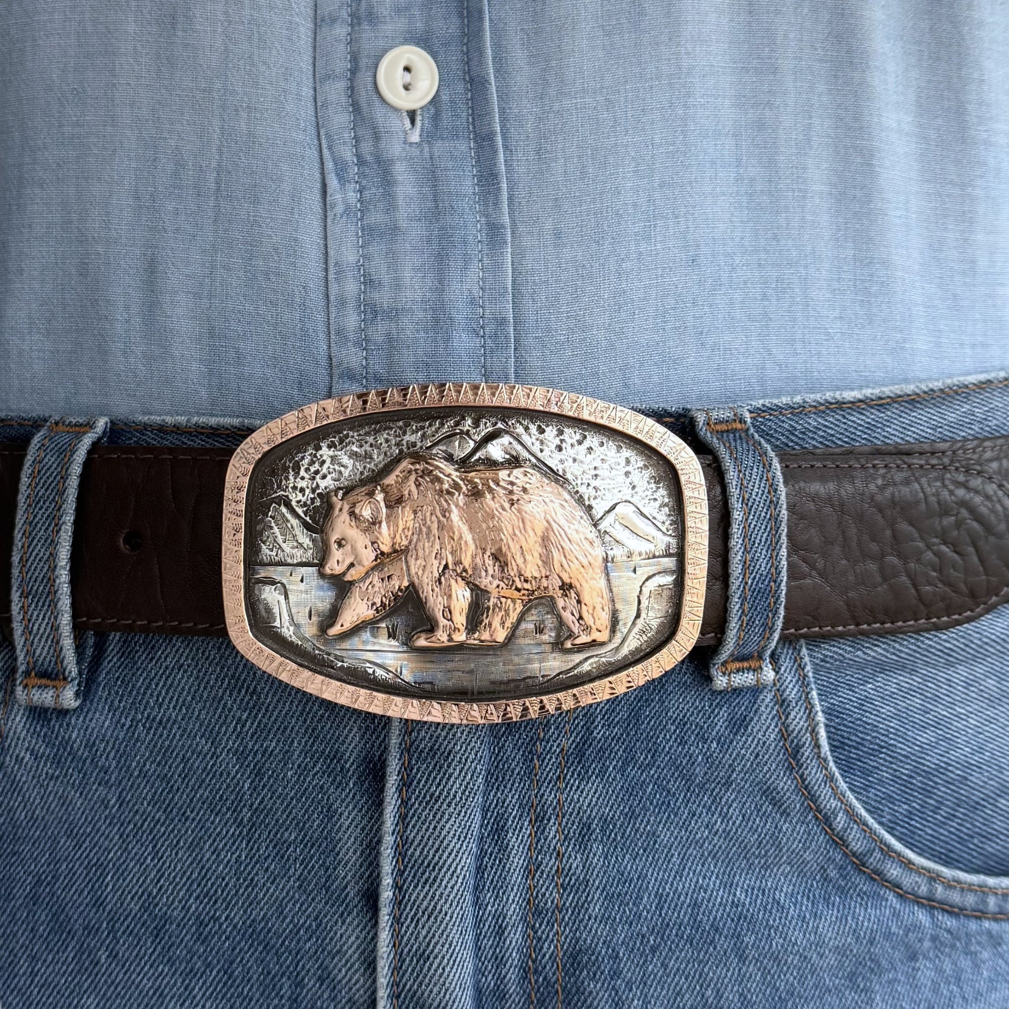 oval rose gold bear with rose gold border on silver engraved buckle