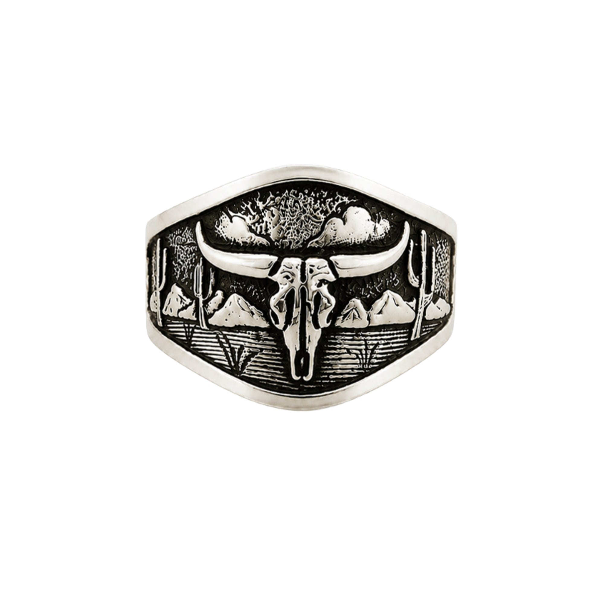 A silver-toned signet ring featuring an engraved desert landscape with a longhorn skull, cacti, mountains, and tents, shown on a plain white background.