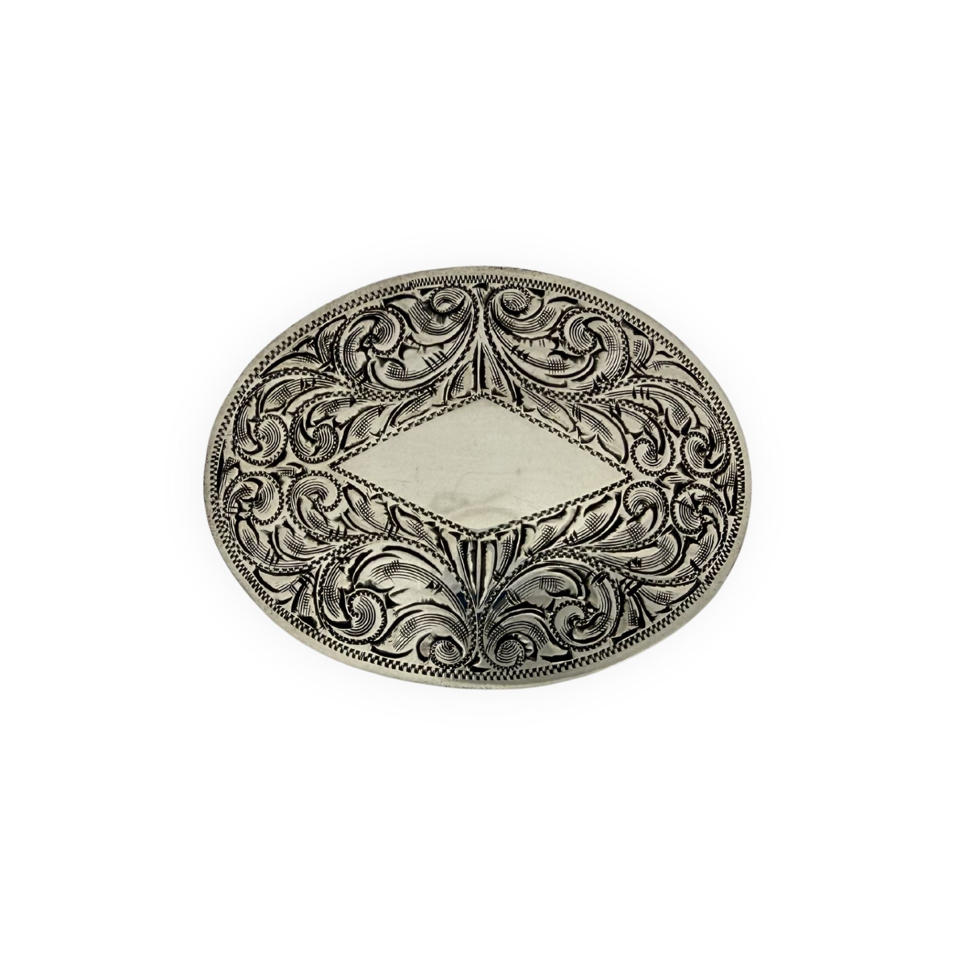 Decorative metal buckle with intricate patterns on a white background