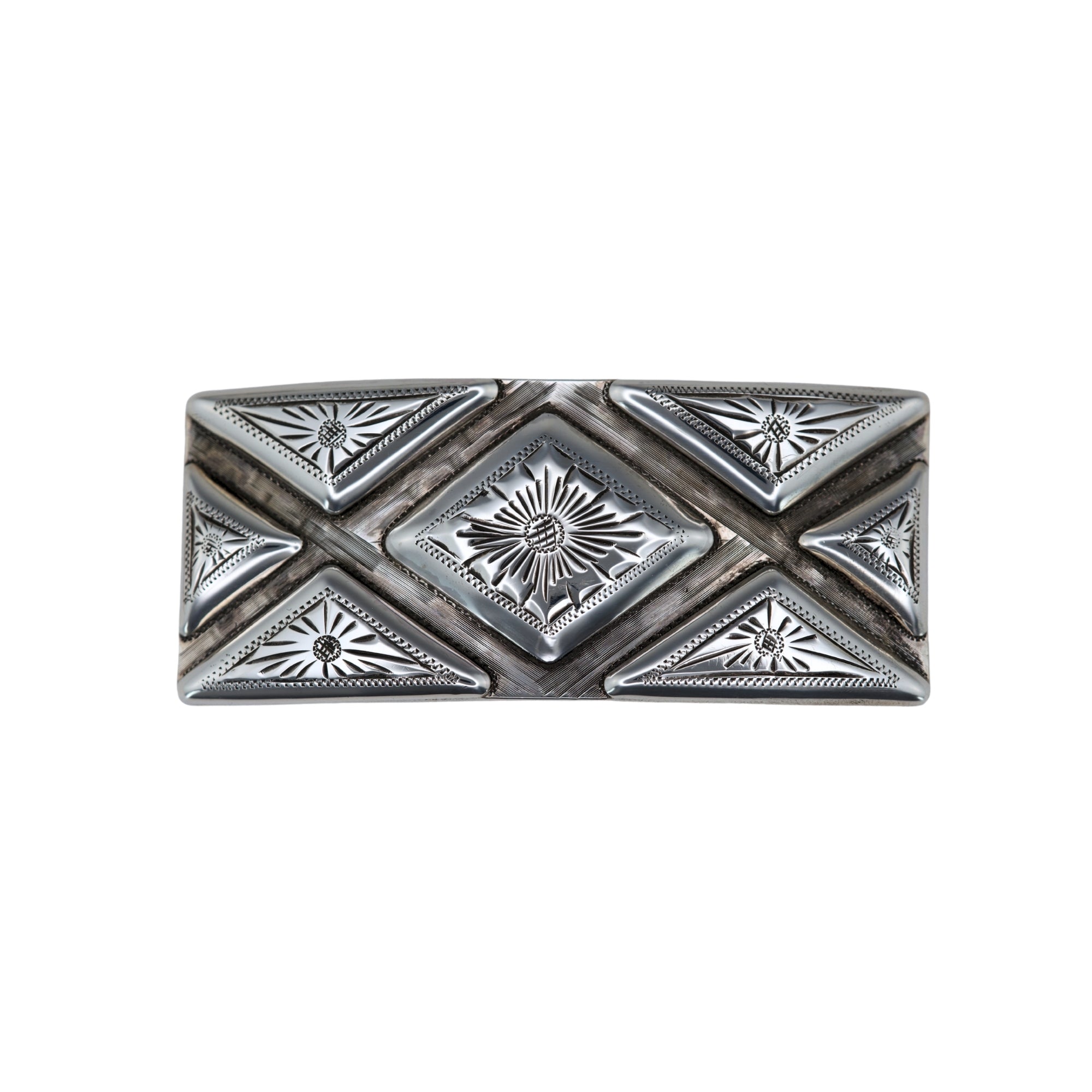 A rectangular silver buckle featuring a Southwestern-style geometric design with a central diamond motif and surrounding triangles, all engraved with starburst and floral patterns.