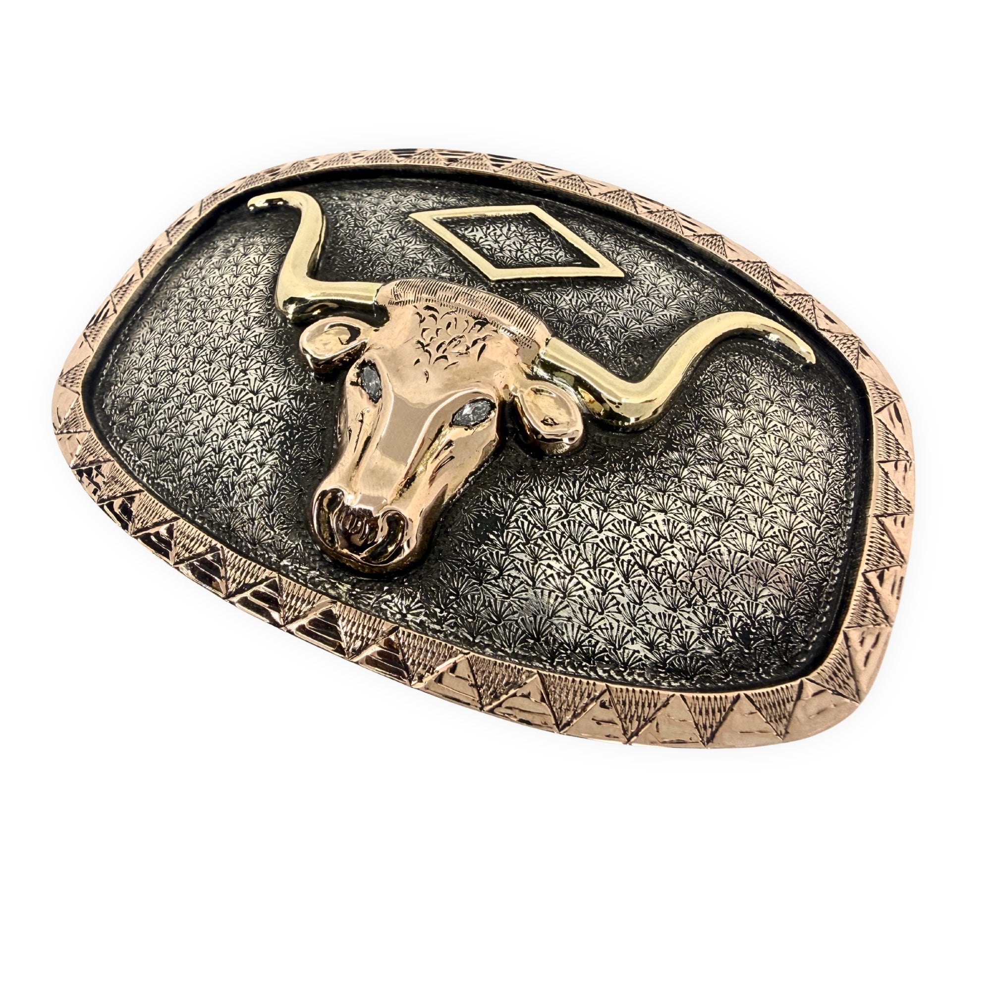 Belt buckle with bull head design on a white background