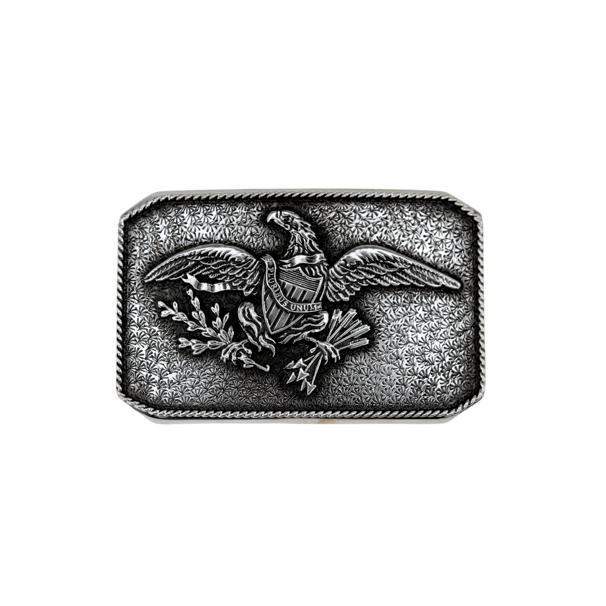 A rectangular silver belt buckle featuring an embossed bald eagle clutching an olive branch and arrows, with a textured patterned background and rope edge.