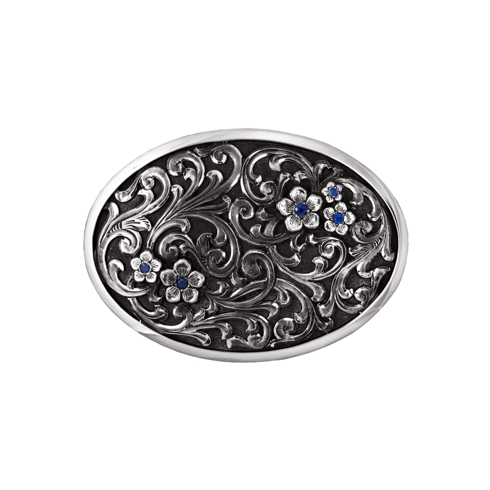 Oval Silver Buckle with overlaid scrolls and sapphires. 