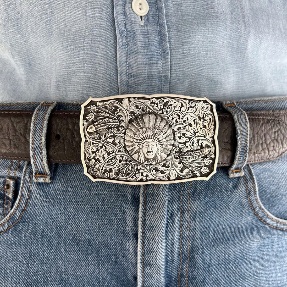 Bohlin 766 Chief Red Wolf sterling silver belt buckle shown on a mannequin, highlighting its size, Western styling, and detailed silver overlays.