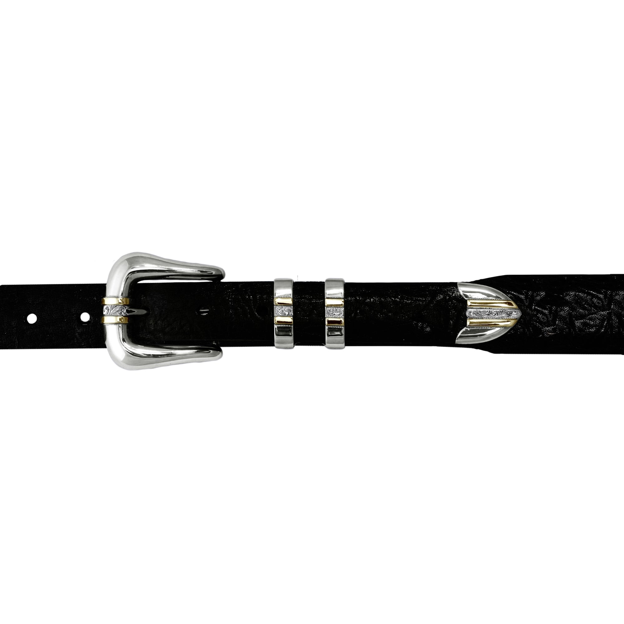 A close-up of a black textured leather belt with dual 14kt Yellow Gold stripes with a traditionally rodeo-engraved center,  on the buckle, keeper, and tip, shown against a plain white background.