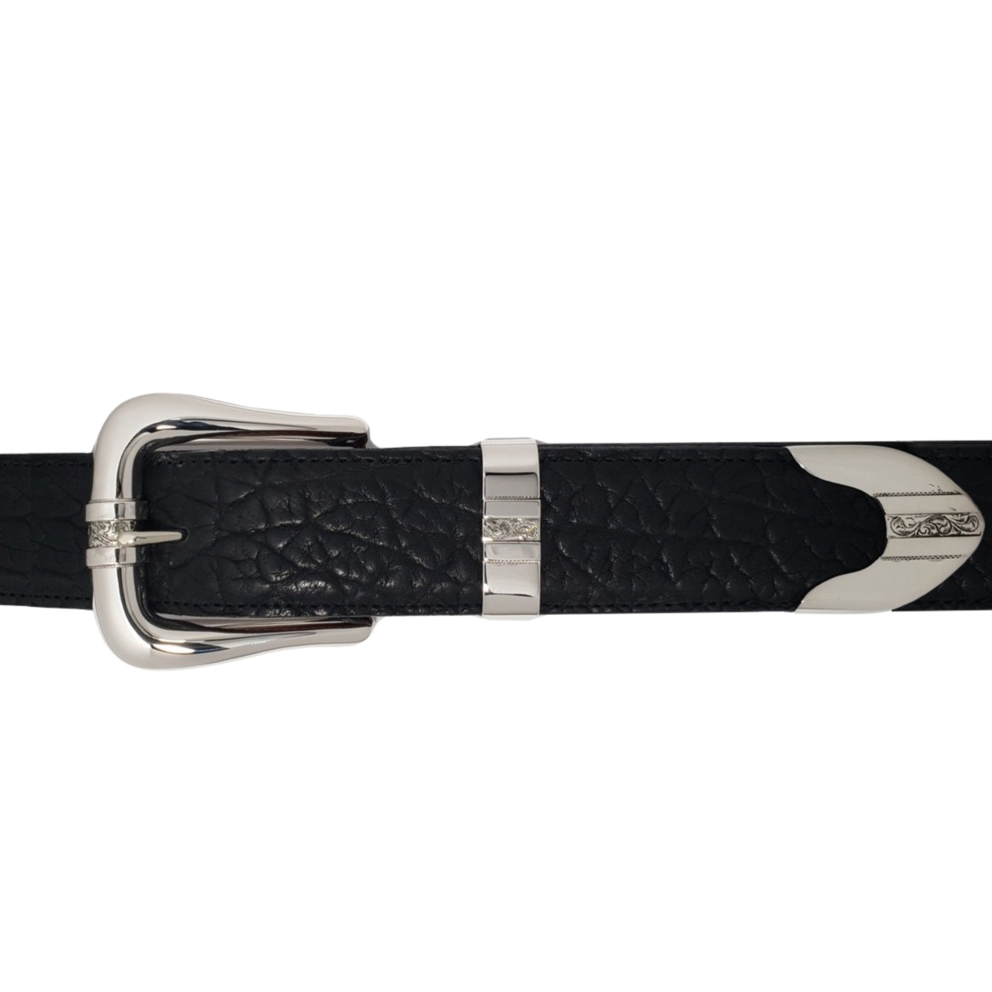 A close-up of a black textured leather belt with polished silver hardware, including a buckle, keeper, and tip embellishments, set against a plain white background.