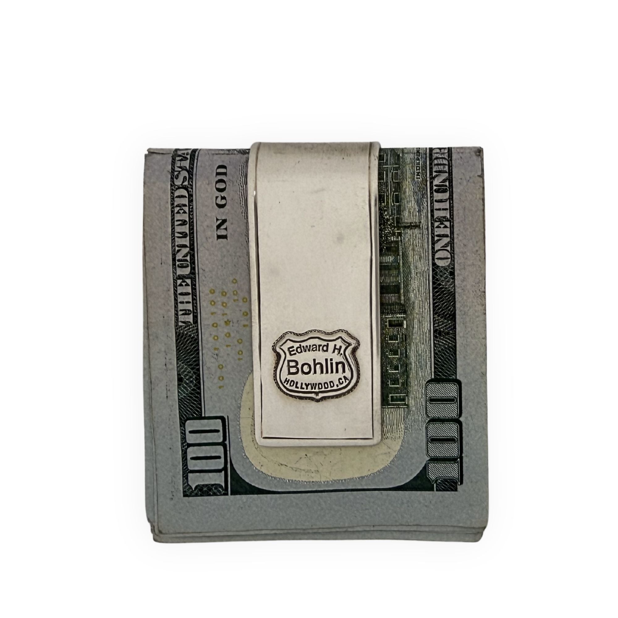 Money clip with a brand logo on a dollar bill background