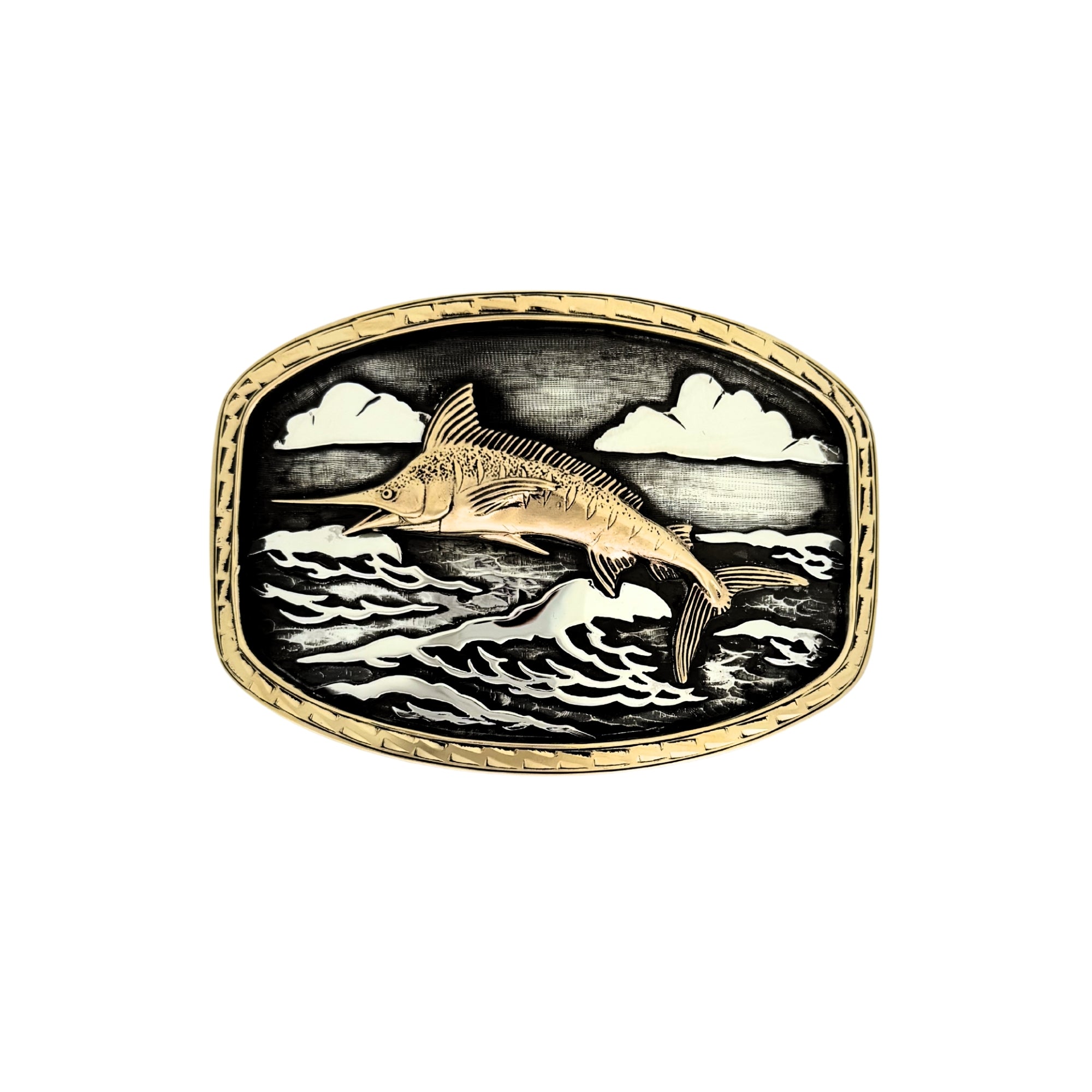 An Oval Silver belt buckle with gold border and a detailed gold Marlin jumping over stylized waves and clouds, set against a plain white background.
