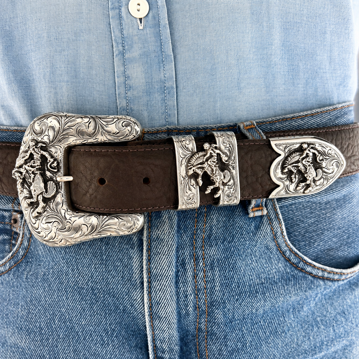 Hank Williams Jr. Bucking Horse Ranger Set in sterling silver shown worn on a belt at the waist.